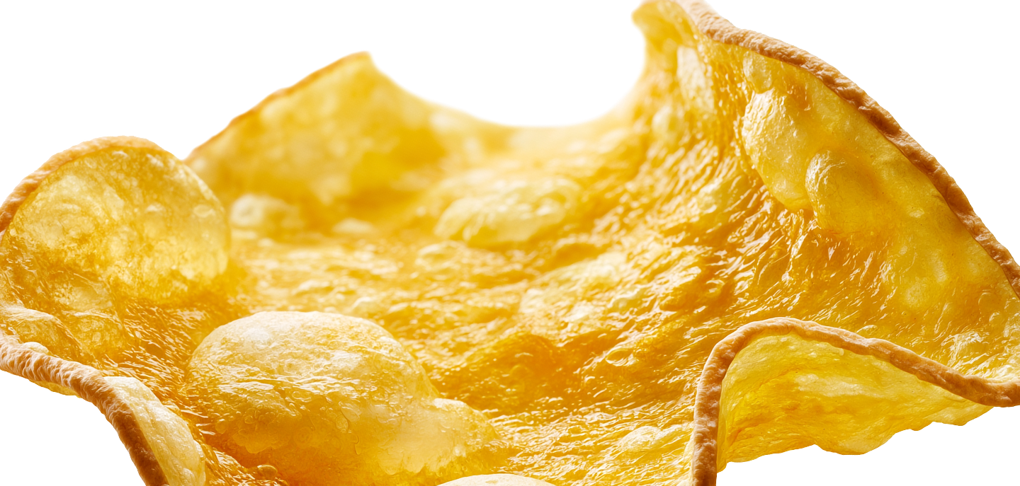 A bowl heaped with golden, translucent NÜKT crisps
